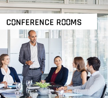 Conference Room with Men standing and speaking